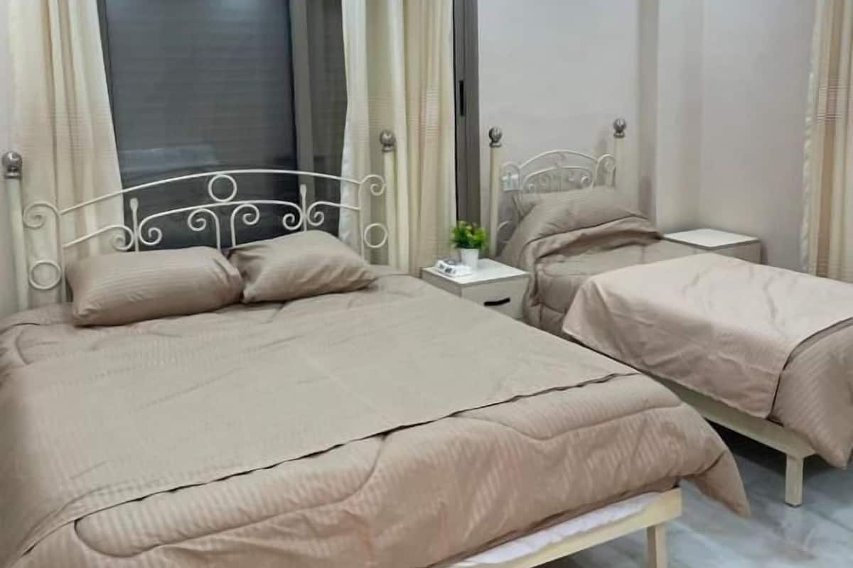 Deluxe Triple Room, Balcony, City View | In-room safe, blackout drapes, soundproofing, free WiFi