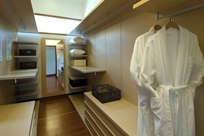 A walk-in closet with shelves, a hanging robe, and a basket. - Soothing 4-bedroom house with AC in charming Aspen (Aspen)