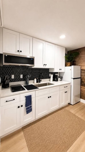 Fridge, microwave, stovetop, coffee/tea maker