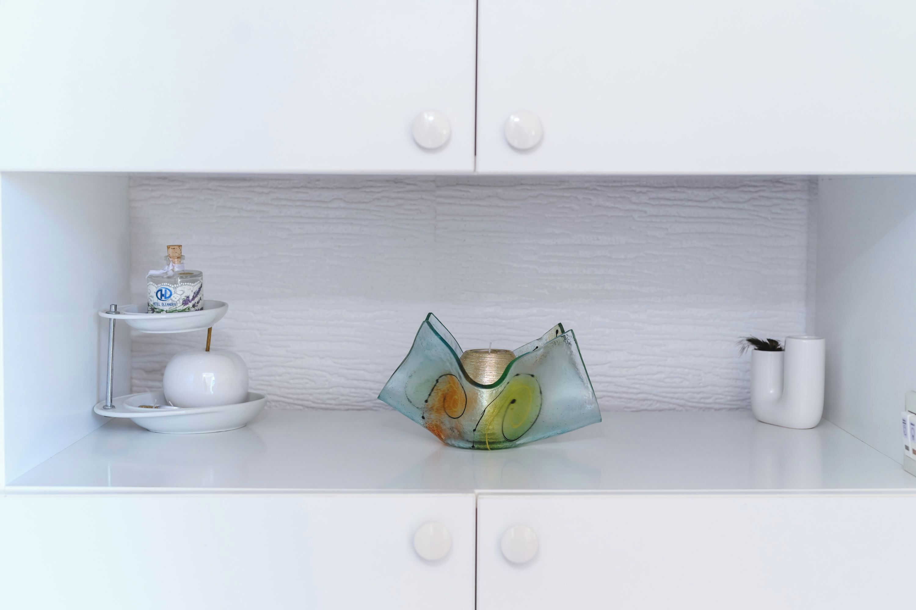A white cabinet with two drawers and a shelf.