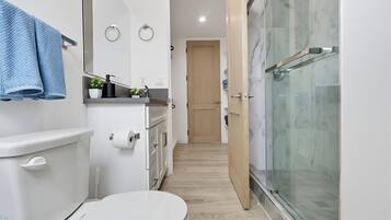 Shower, hair dryer, towels, soap