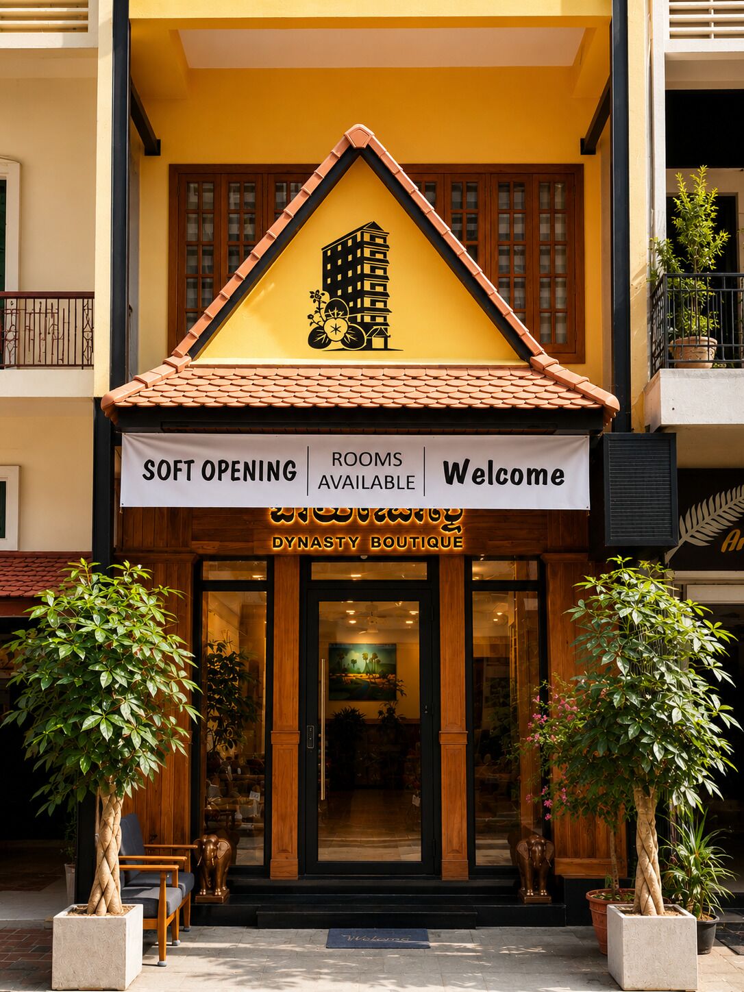A boutique hotel entrance with a sign indicating soft opening, available rooms, and a welcome message.