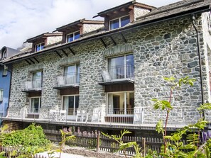 A stone building with multiple balconies and windows. - Residenz Soliva App. Viola by Interhome (Sils Maria)