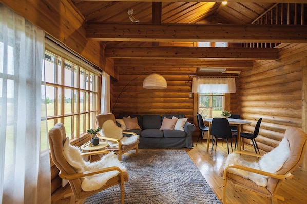 Comfort Cabin, 2 Bedrooms | Living area | 45-inch Smart TV with cable channels, fireplace - Villa Tilhi - Peaceful 2BR Cabin in Ruka (Kuusamo)