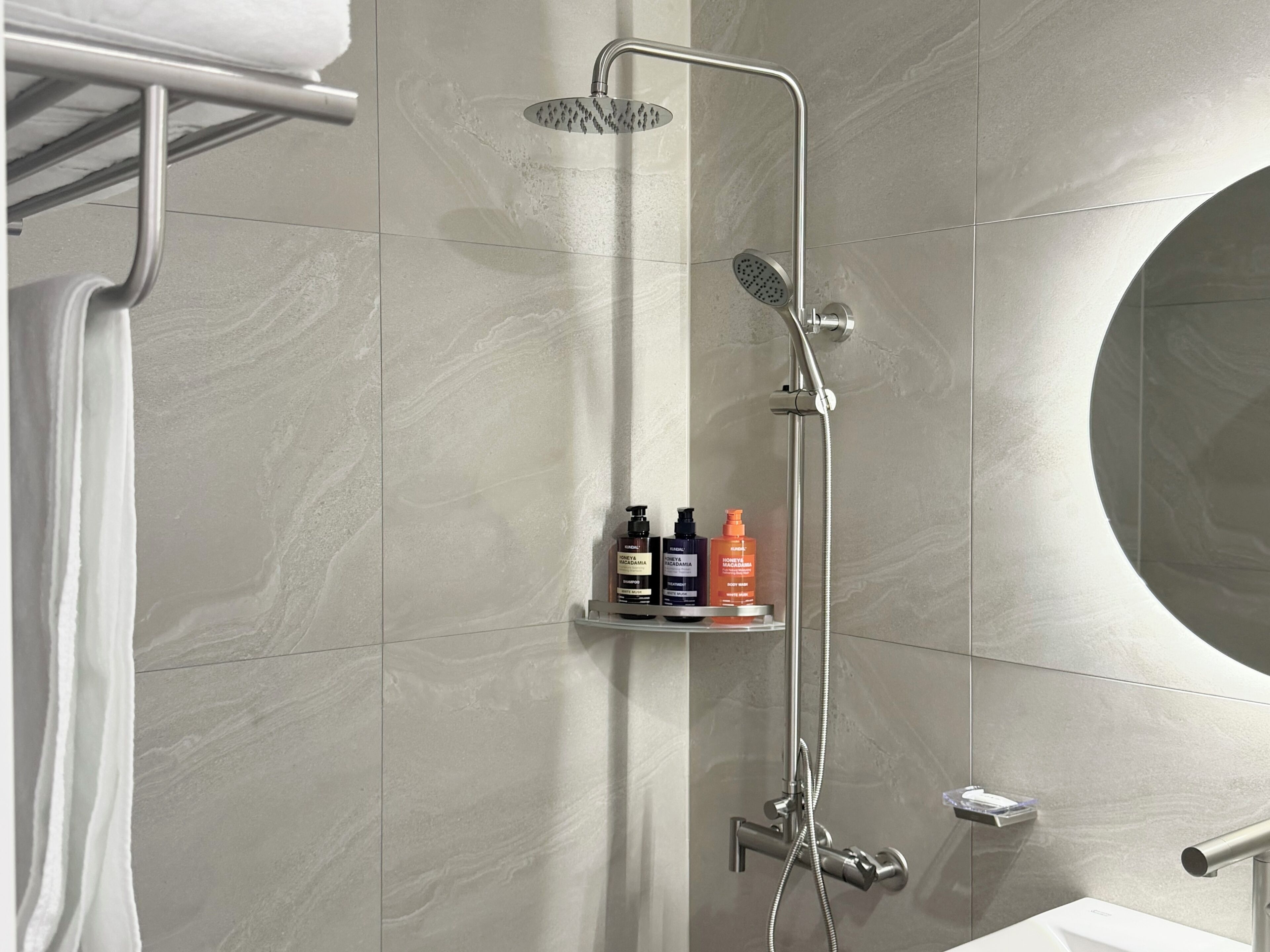 Shower, hair dryer, towels, shampoo