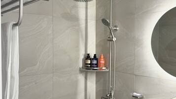 Shower, hair dryer, towels, shampoo