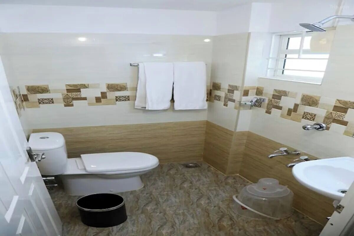 Shower, rainfall showerhead, towels, soap