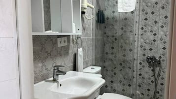Shower, hair dryer, slippers, towels