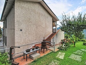 A modern house with a patio, outdoor furniture, and a staircase leading to a second floor. - Cà Olivella by Interhome (Casarza Ligure)