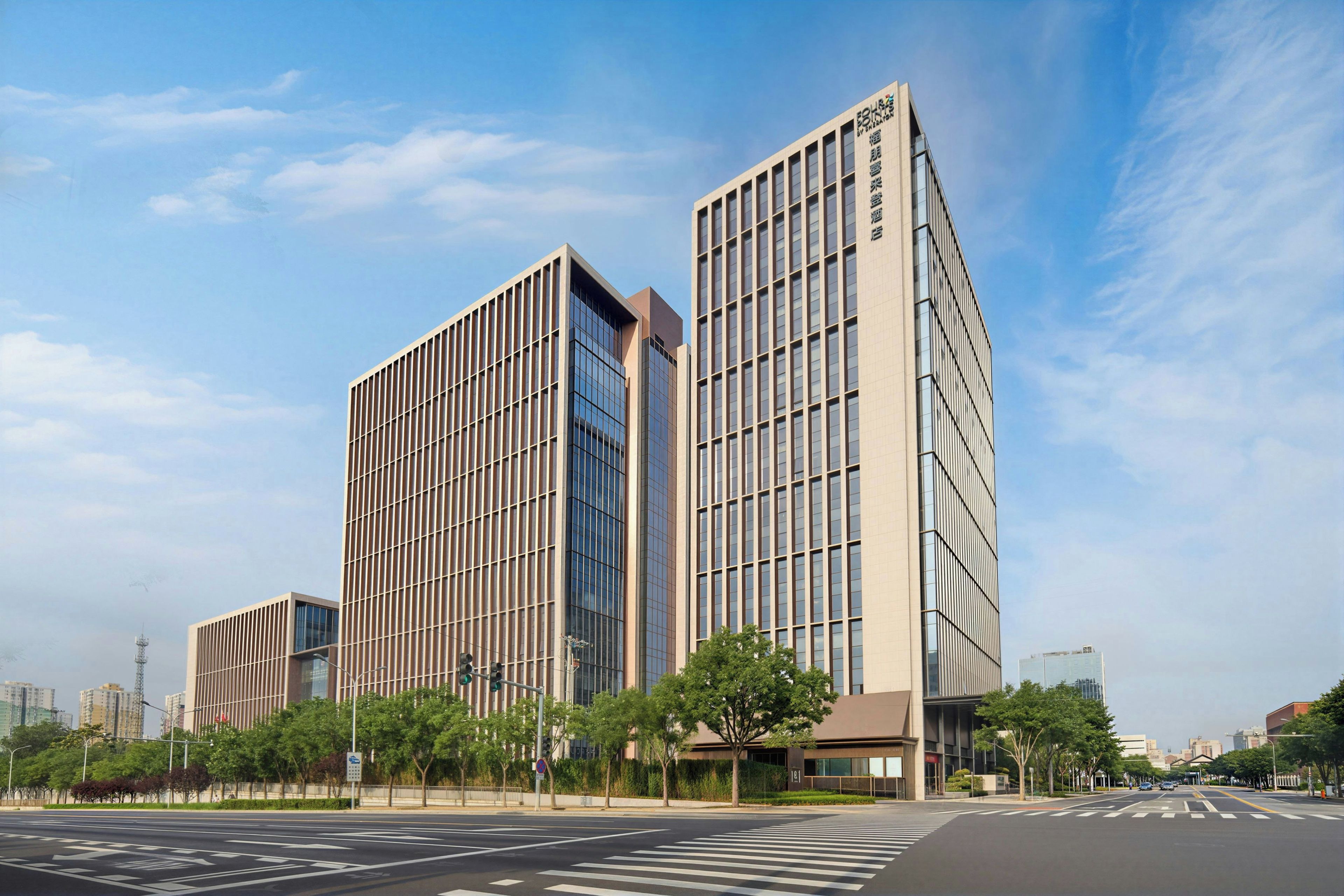 A modern building with a flat facade and large windows.