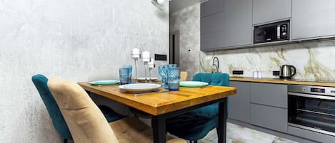 Luxury Apartment, Balcony, City View | Private kitchen | Electric kettle, griddle, cleaning supplies, freezer
