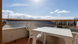 A balcony with a table and chairs, a view of the cityscape, and a clear sky. - Classic Riviera Escape With Pool, Grasse (Grasse)