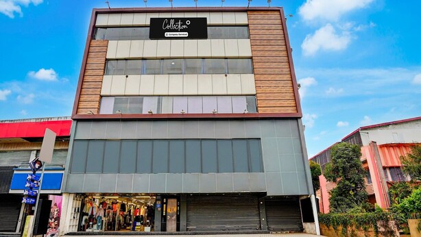 A multi-story building with a sign reading 'Collection.' - Collection O Kotdwar Railway Junction (Kotdwāra)