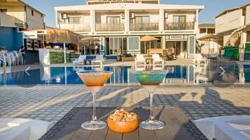 Family Room, Partial Sea View | Pool | Seasonal outdoor pool