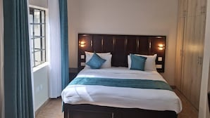 غرفة ديلوكس مزدوجة أو بسريرين منفصلين - منظر للحديقة | ستائر تعتيم ومكواة/لوح كي وواي فاي