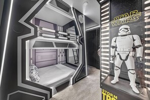 A Star Wars themed room with a bunk bed, a Star Wars poster, and a Stormtrooper figure. - 9BR villa sleeps 22 with pool table in kissimmee (Kissimmee)