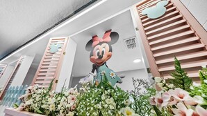 A large Mickey Mouse statue in a floral arrangement. - 9BR villa sleeps 22 with pool table in kissimmee (Kissimmee)