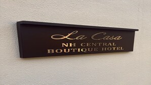 A sign for La Casa NH Central Boutique Hotel. - La Casa Boutique Nizami (Baku)