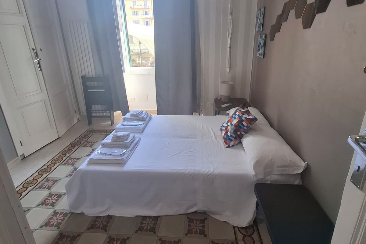 Deluxe Suite, Balcony, City View | Minibar, blackout drapes, soundproofing, iron/ironing board