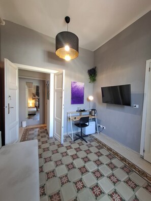 Suite Deluxe, balcon, vue ville | Coin séjour