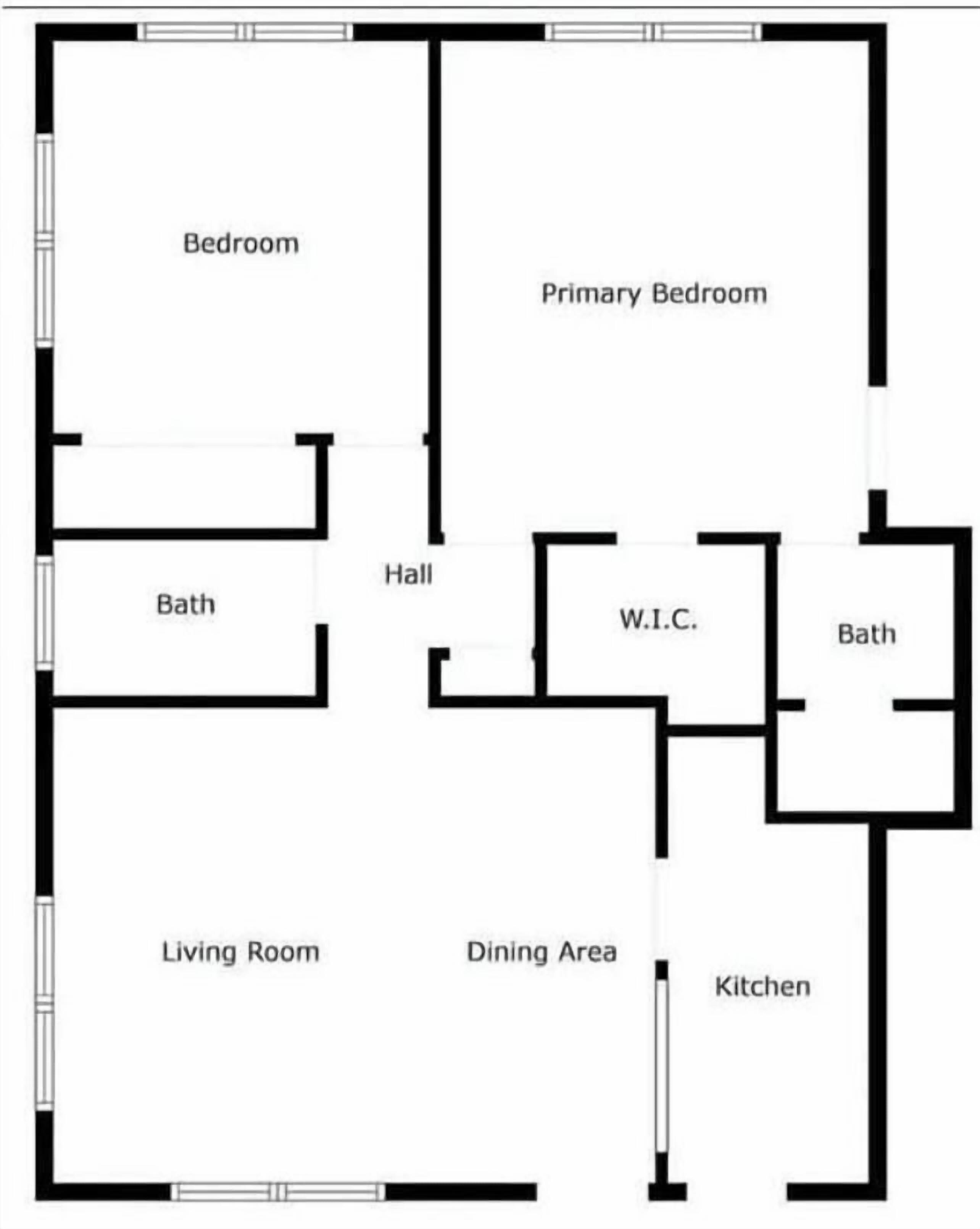 Plano de planta que muestra un dormitorio, habitación principal, baño, sala de estar, comedor, cocina, pasillo y vestidor.