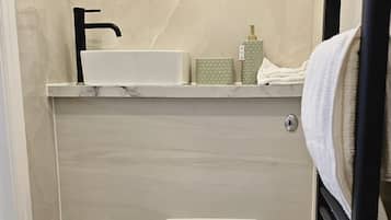 Shower, towels, soap, toilet paper