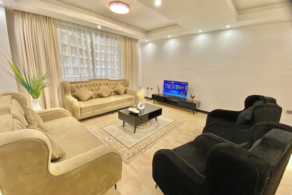 Clean, bright, and spacious living area with a Smart TV, private balcony & views