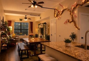 A home interior with a dining area, kitchen, and living room.