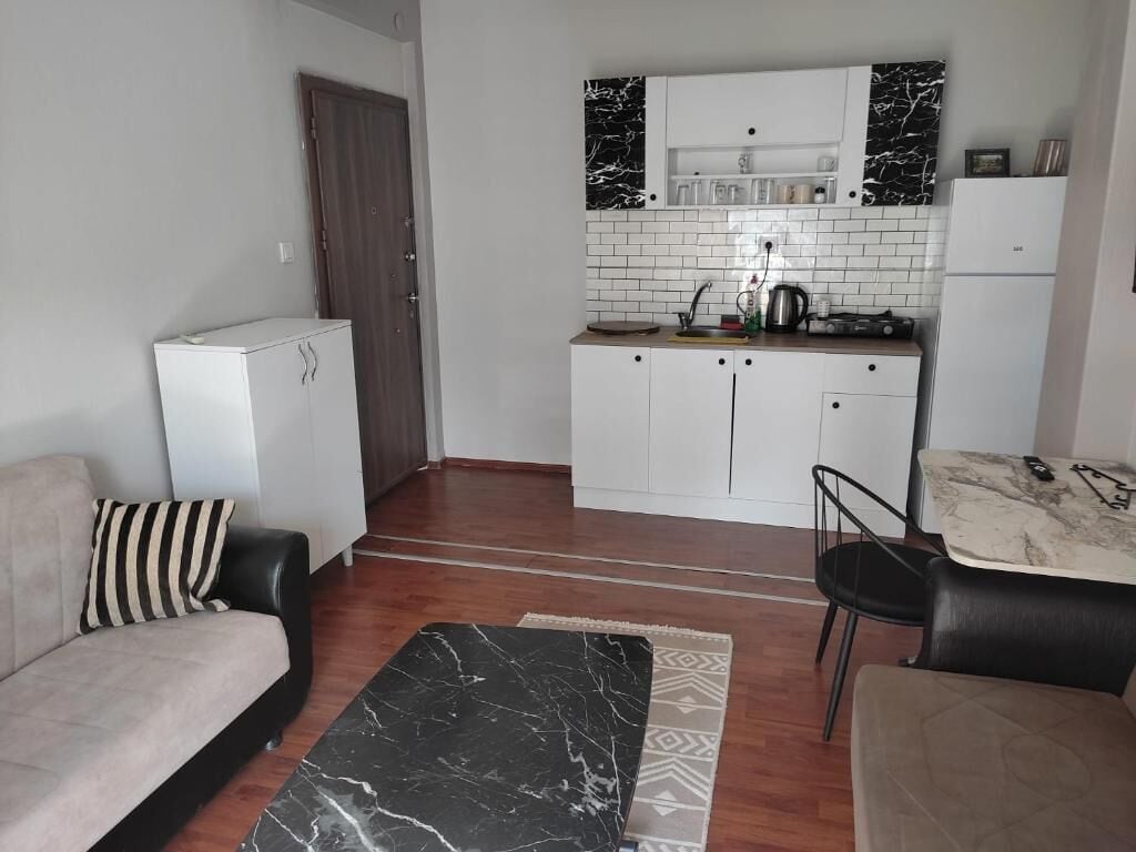 Apartment, Garden View | Living area | 43-inch LCD TV with satellite channels