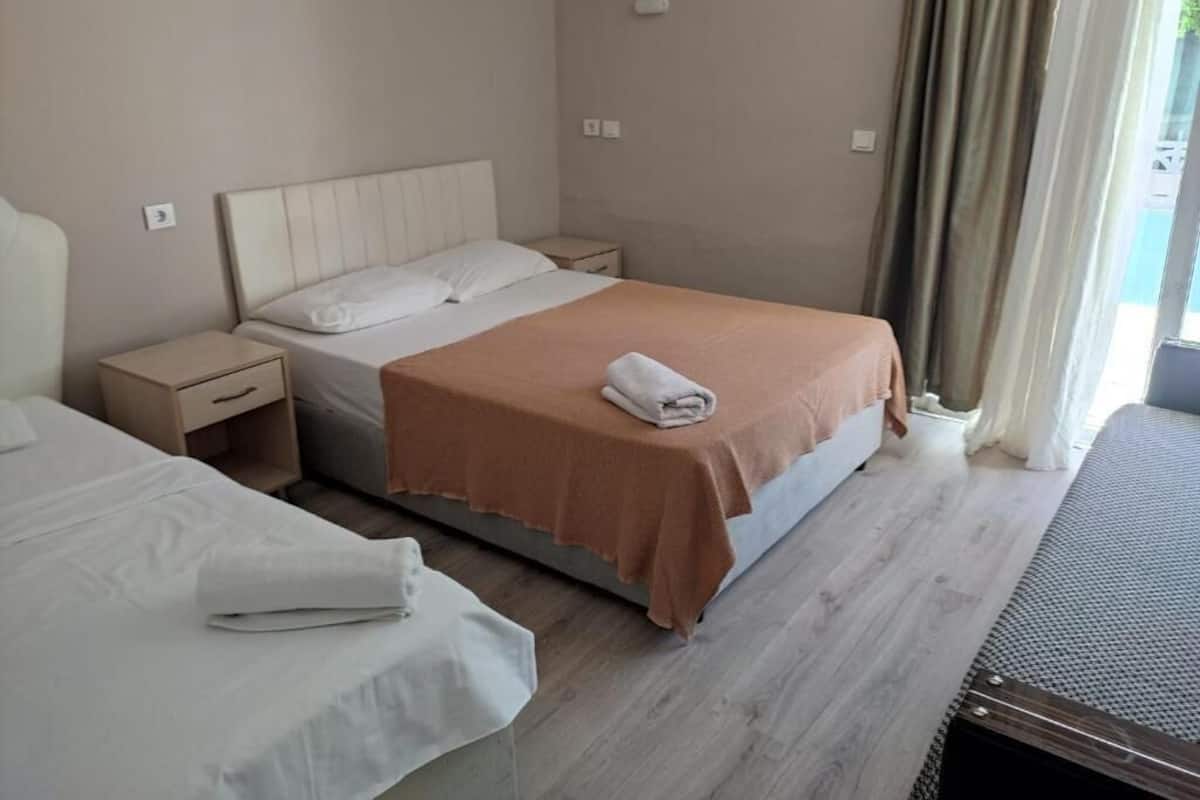 Triple Room, Balcony, City View | Iron/ironing board, free WiFi