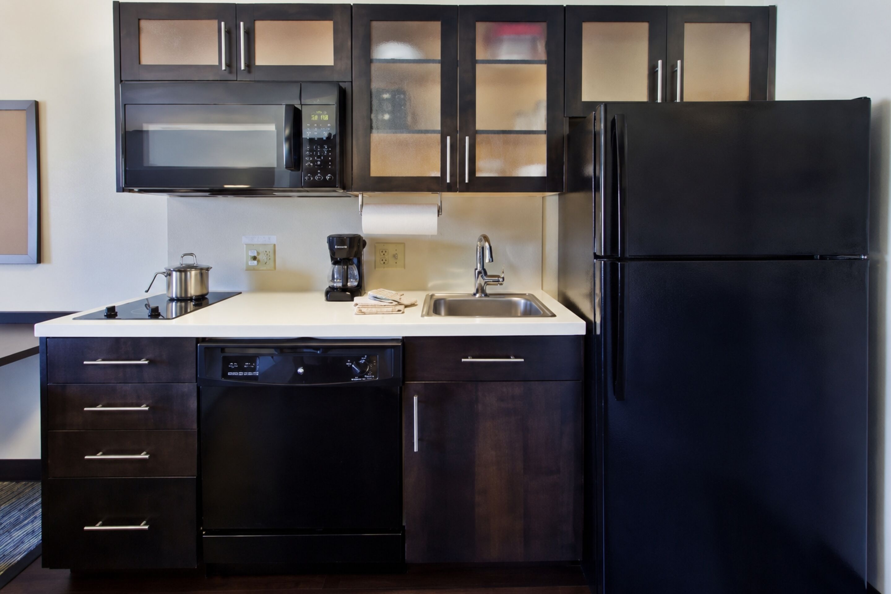 Coffee/tea maker, fridge, microwave, paper towels