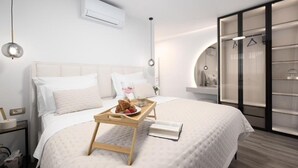 A modern hotel room with a bed, bedside table, and a wardrobe with a mirror. - Luxury villa Speranza with heated saltwater pool (VINJANI DONJI,IMOTSKI)