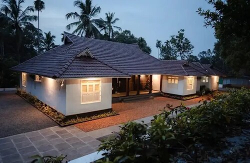 Kerala style heritage pool villa on western ghats.