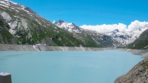 A mountain lake with rocky shores and snow-capped peaks in the background. - Amedee Appartement/Fewo 5-Bettwohnung Nr. 1 by Interhome (Saas-Fee)