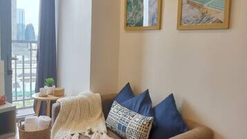 Apartment, 1 Bedroom | Living area | 35-inch Smart TV with digital channels