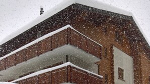 A multi-story building with a snow-covered roof and balconies. - Swiss Chalet Appartement/Fewo 2-Bettwohnung Nr. 5 by Interhome (Saas-Fee)