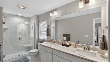 Shower, hair dryer, towels, soap