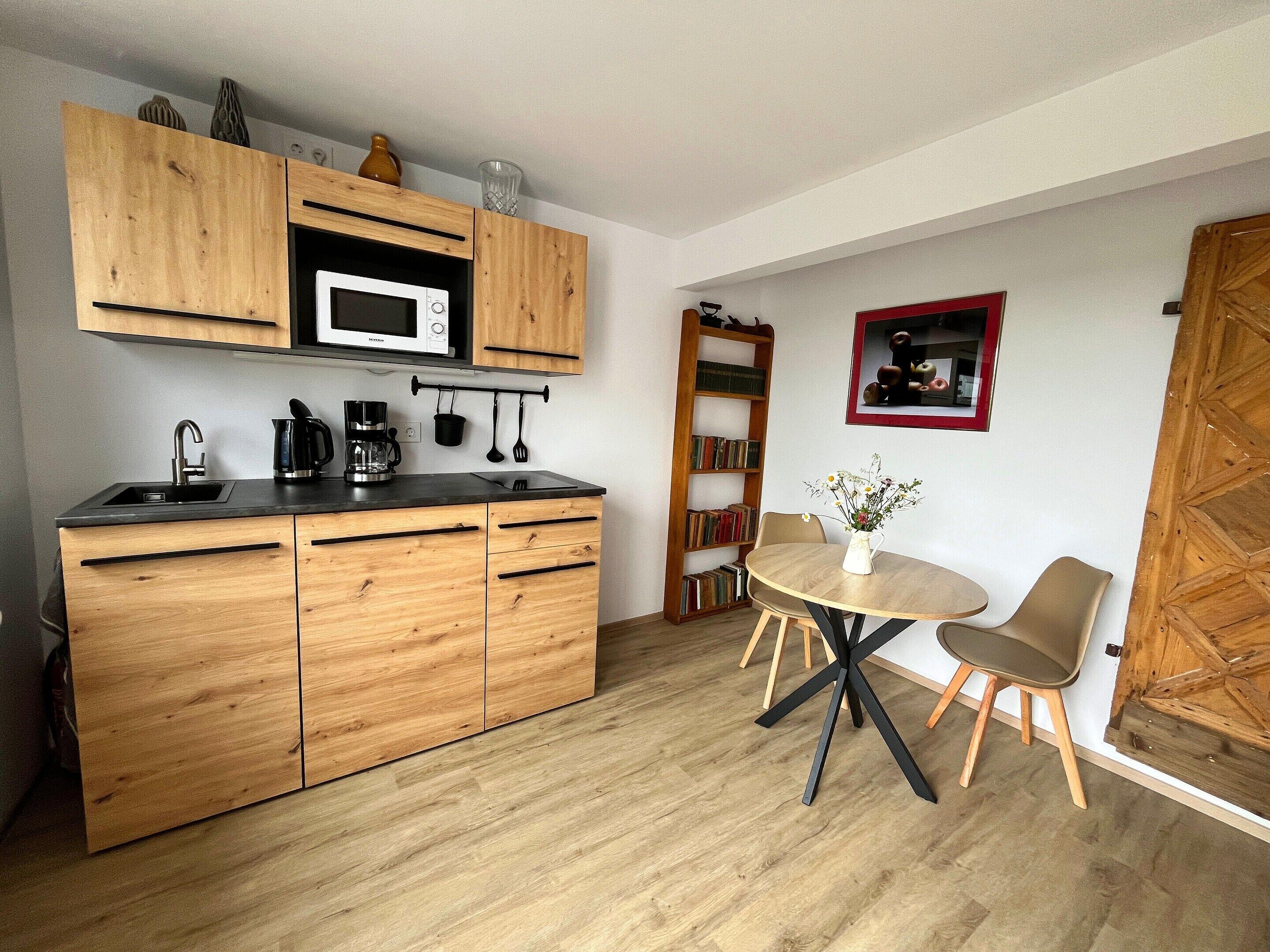 Appartement | Privékeuken | Een kinderstoel