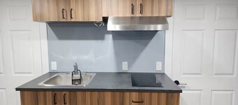 Salt and Spruce private 1 bedroom suite with double bed, kitchen, and laundry