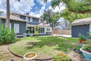 A residential property with a well-maintained lawn, a front door, and a visible garage. - 2-Unit Bundle in Eustis: Walk to Ferran Park! (Eustis)