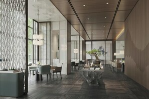 A modern interior with a central seating area, a large window, and a patterned wall. - Beijing Marriott Hotel Huairou (Huairou)