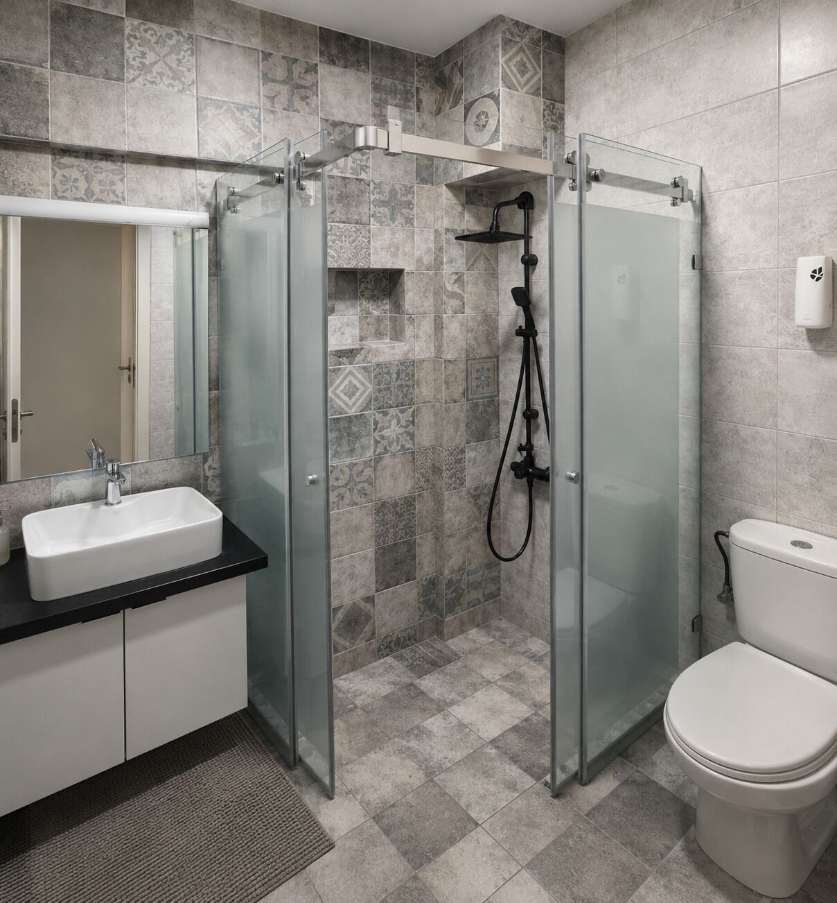 A bathroom with a glass-enclosed shower, a white sink, and a toilet.