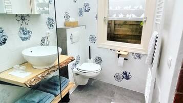 Shower, hair dryer, towels, toilet paper