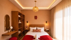 A hotel room with a large bed, a wooden wardrobe, a red ottoman, and a large window with curtains. - Luxury Berber Chic•3mn to Beach•Rooftop•Balcony•AC (Imi Ouaddar)