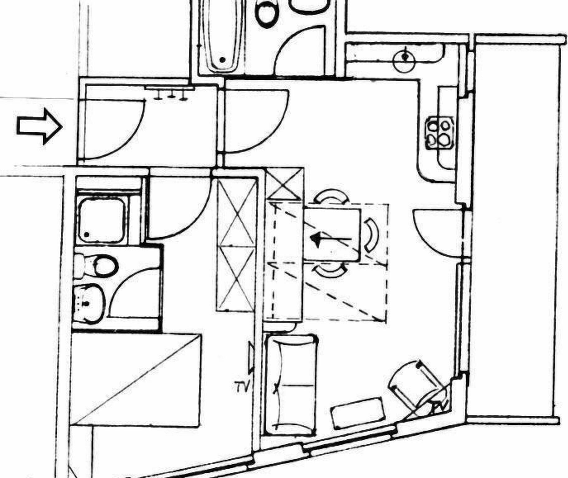 Ein Grundriss mit einer Küche, einem Essbereich und einem Badezimmer.