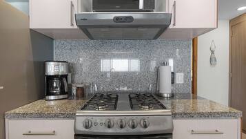 Coffee/tea maker, fridge, microwave, oven