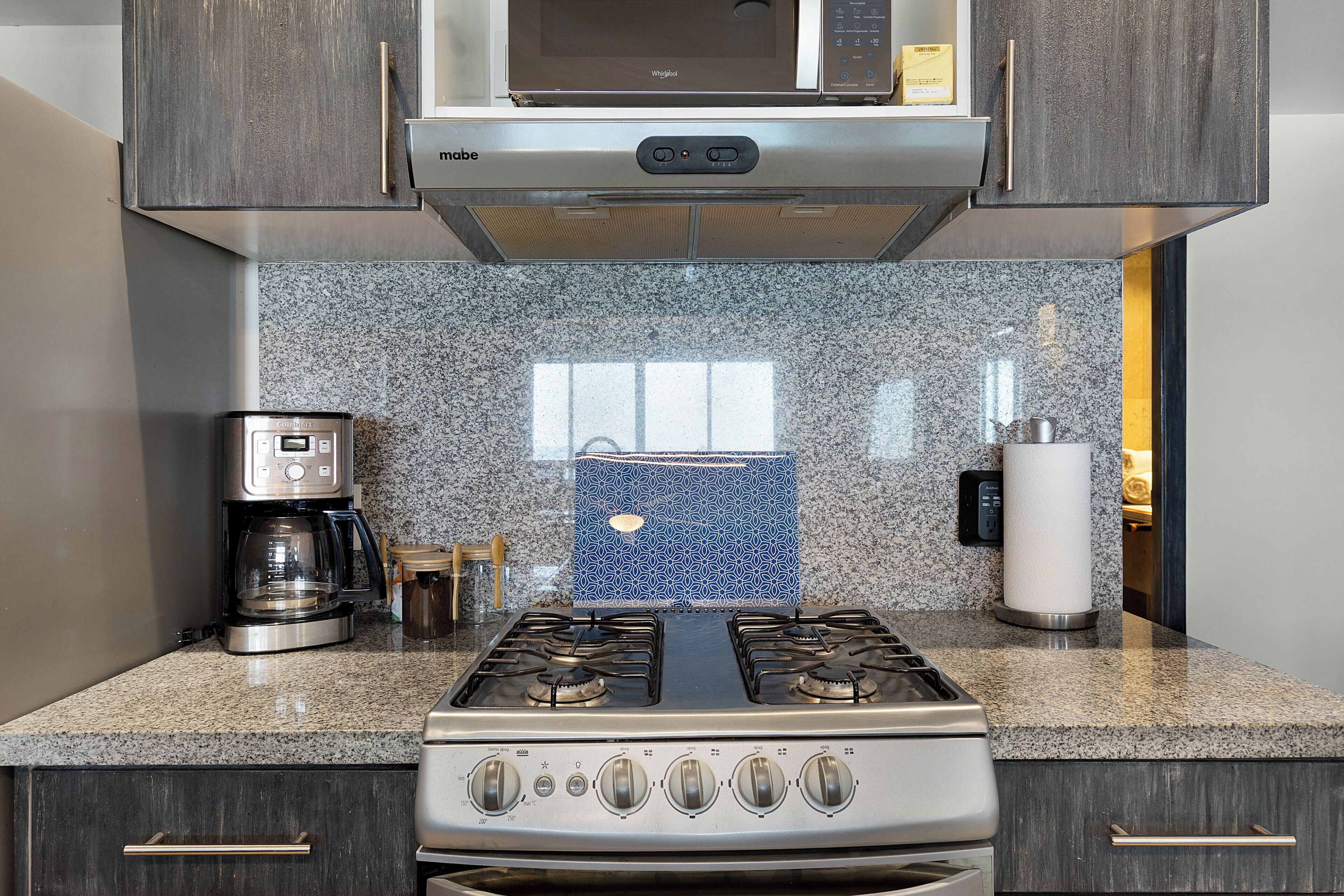 Coffee/tea maker, fridge, microwave, oven