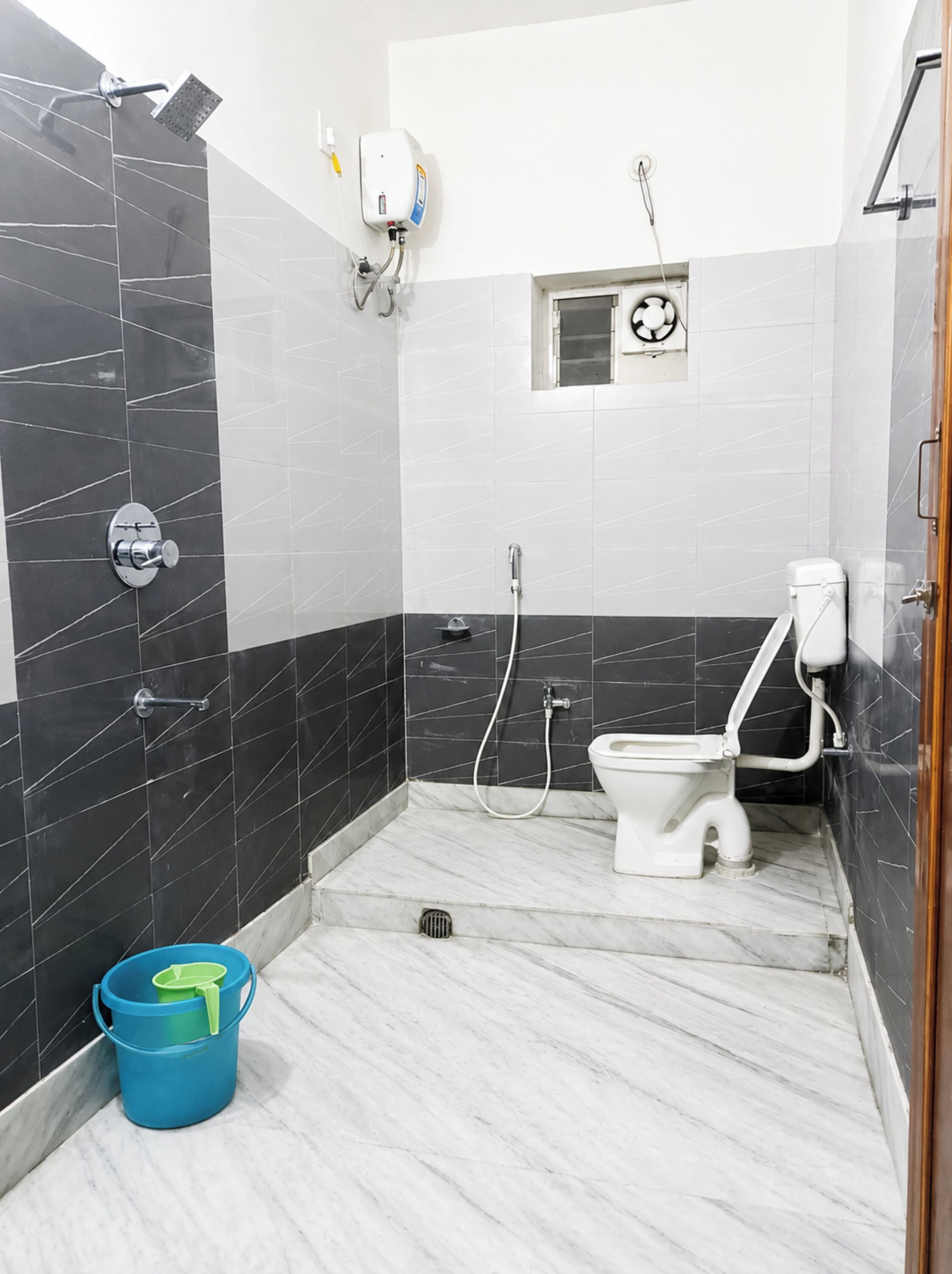 Shower, rainfall showerhead, slippers, towels