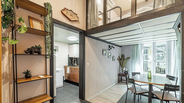 A modern interior with a dining area, kitchen, and a view of the outside. - Warm Apartment a/c 2br/6p - Nice (Nice)