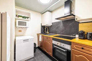 Departamento | Cocina privada | Cafetera y tetera, refrigerador, microondas y horno 